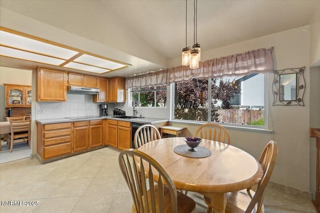 4492 Trenton Ct, Sparks, NV 89436 - kitchen with light countertops, light tile patterned floors, backsplash, black appliances, and vaulted ceiling