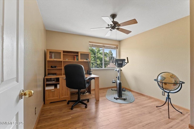 4492 Trenton Ct, Sparks, NV 89436 - office area featuring light wood finished floors, a ceiling fan, and a textured ceiling