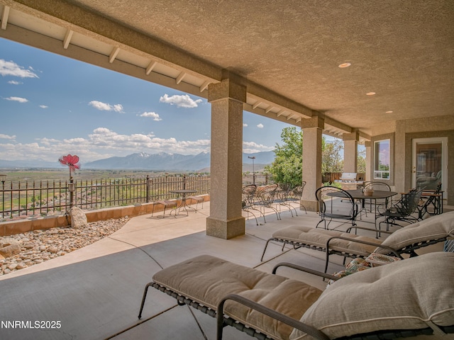 1037 Haystack Dr, Carson City, NV 89705 - view of patio with outdoor dining area and a mountain view