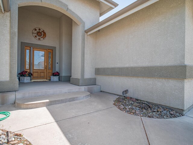 1037 Haystack Dr, Carson City, NV 89705 - property entrance featuring stucco siding and covered porch