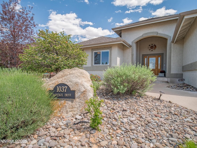 1037 Haystack Dr, Carson City, NV 89705 - property entrance with stucco siding