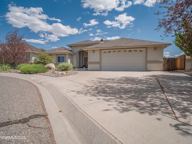 1037 Haystack Dr, Carson City, NV 89705 - view of front of property featuring stucco siding, concrete driveway, and a garage