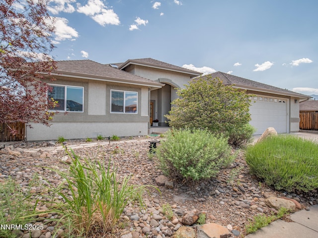 1037 Haystack Dr, Carson City, NV 89705 - view of front facade with stucco siding, an attached garage, and driveway