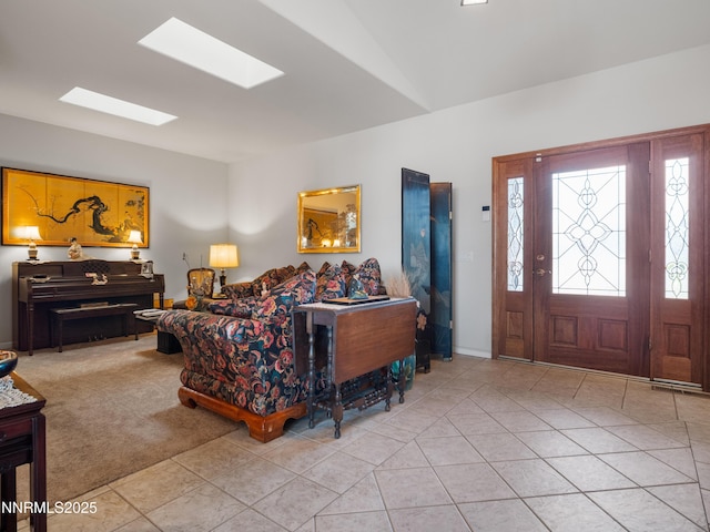 1037 Haystack Dr, Carson City, NV 89705 - living area featuring a skylight, light tile patterned floors, and vaulted ceiling