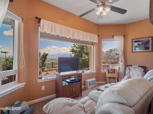 1037 Haystack Dr, Carson City, NV 89705 - carpeted living room featuring baseboards and ceiling fan
