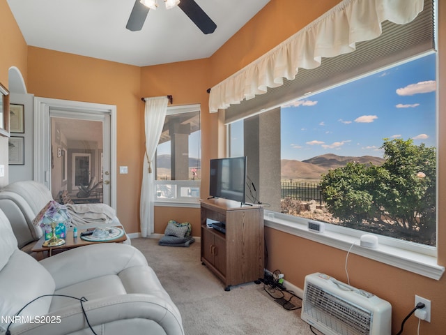 1037 Haystack Dr, Carson City, NV 89705 - living area featuring light carpet, ceiling fan, baseboards, and heating unit