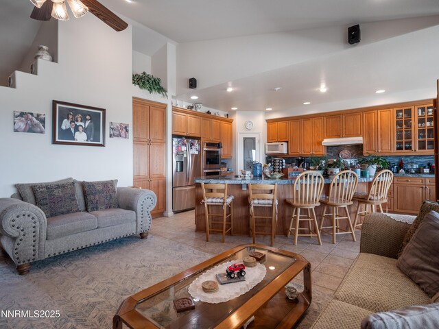 1037 Haystack Dr, Carson City, NV 89705 - living room featuring high vaulted ceiling, ceiling fan, recessed lighting, and light tile patterned floors