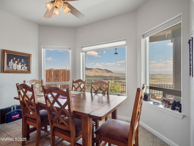 1037 Haystack Dr, Carson City, NV 89705 - dining space featuring light tile patterned floors, ceiling fan, and a mountain view