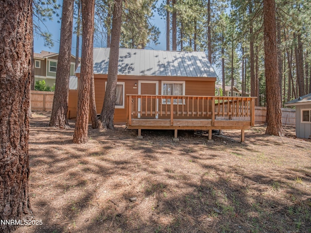3790 Stewart Way S, Lake Tahoe, CA 96150 - back of property featuring a wooden deck and metal roof