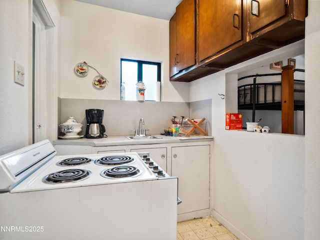 3790 Stewart Way S, Lake Tahoe, CA 96150 - kitchen with electric stove, a sink, light countertops, and brown cabinetry