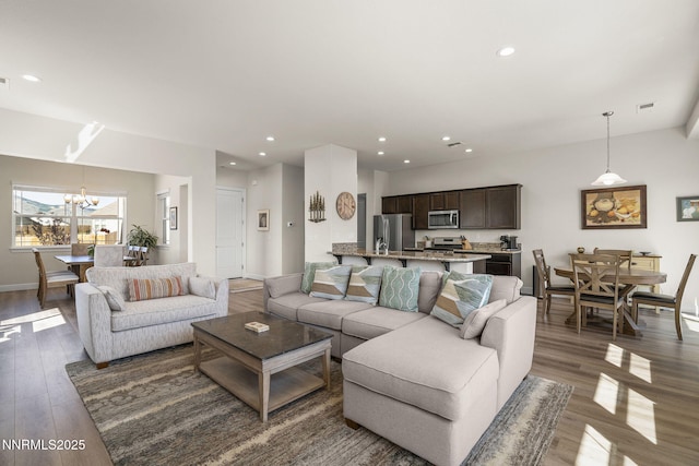 910 Cranfield Ct, Reno, NV 89506 - living room featuring wood finished floors, a chandelier, recessed lighting, and baseboards