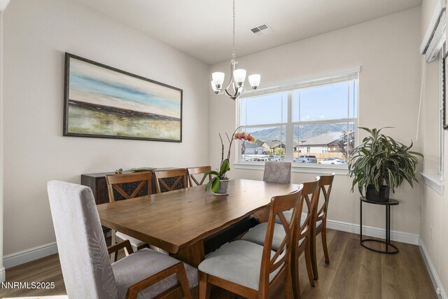 910 Cranfield Ct, Reno, NV 89506 - dining space with wood finished floors, baseboards, and a chandelier
