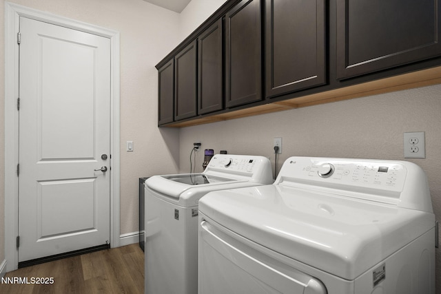 910 Cranfield Ct, Reno, NV 89506 - washroom with dark wood-style flooring, washing machine and dryer, cabinet space, and baseboards