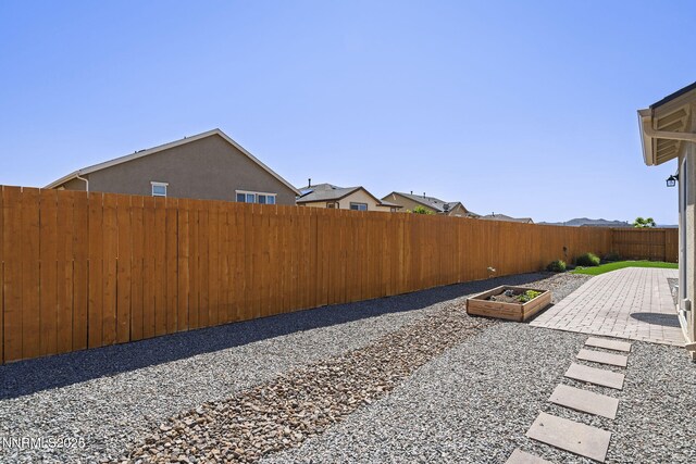 910 Cranfield Ct, Reno, NV 89506 - fenced backyard with a patio area and a garden
