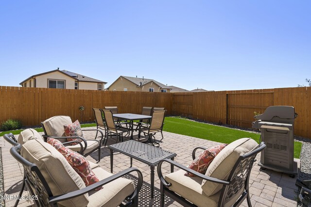 910 Cranfield Ct, Reno, NV 89506 - fenced backyard with outdoor lounge area, a patio area, area for grilling, and outdoor dining space