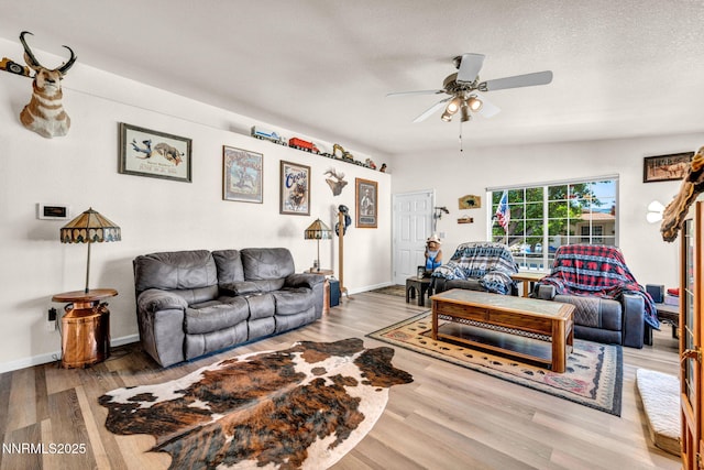 17533 Javalina Ct, Reno, NV 89508 - living room featuring ceiling fan, wood finished floors, and baseboards