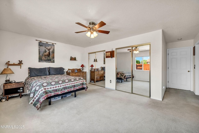 17533 Javalina Ct, Reno, NV 89508 - bedroom with two closets, light colored carpet, and a ceiling fan