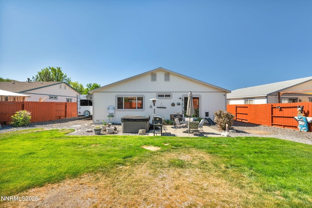 17533 Javalina Ct, Reno, NV 89508 - back of house featuring a patio area and a hot tub