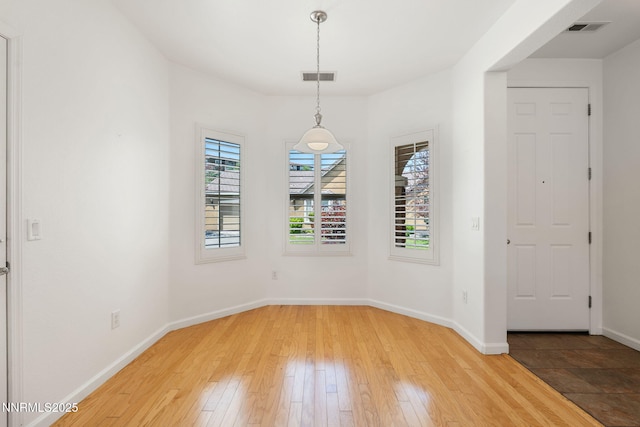 469 N Sand Crane Cir, Sparks, NV 89436 - unfurnished dining area with light wood-type flooring and baseboards