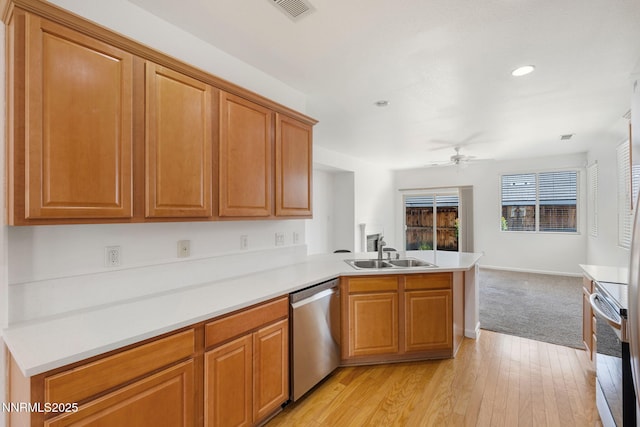 469 N Sand Crane Cir, Sparks, NV 89436 - kitchen with appliances with stainless steel finishes, a sink, a peninsula, a ceiling fan, and open floor plan