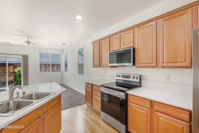 469 N Sand Crane Cir, Sparks, NV 89436 - kitchen with appliances with stainless steel finishes, a sink, a ceiling fan, recessed lighting, and light countertops