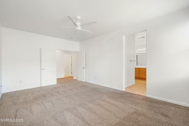 469 N Sand Crane Cir, Sparks, NV 89436 - unfurnished bedroom with light colored carpet, connected bathroom, baseboards, and a ceiling fan