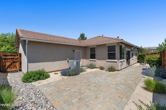 469 N Sand Crane Cir, Sparks, NV 89436 - back of property with stucco siding, a tile roof, and a patio