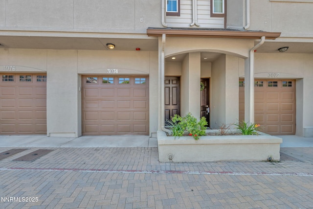 3074 Sterling Ridge Cir, Sparks, NV 89431 - doorway to property featuring stucco siding and an attached garage