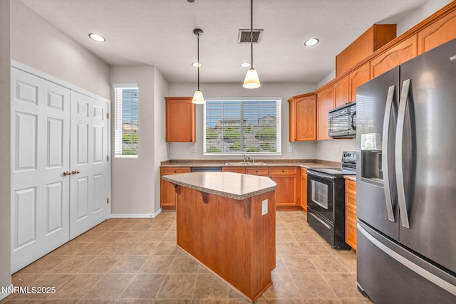 3074 Sterling Ridge Cir, Sparks, NV 89431 - kitchen featuring black appliances, recessed lighting, decorative light fixtures, a center island, and a breakfast bar