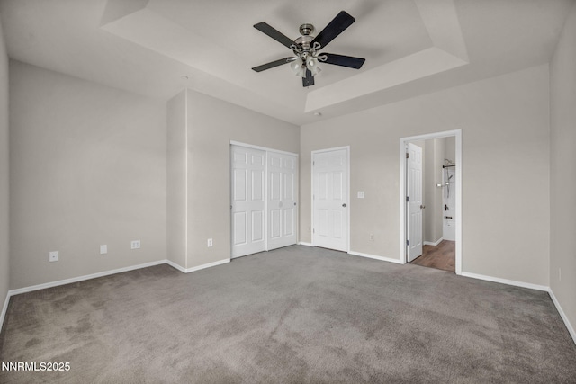 3074 Sterling Ridge Cir, Sparks, NV 89431 - unfurnished bedroom featuring a raised ceiling, carpet, connected bathroom, and ceiling fan