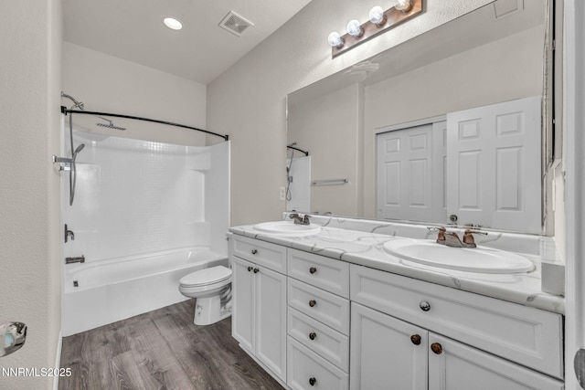 3074 Sterling Ridge Cir, Sparks, NV 89431 - bathroom featuring double vanity, bathtub / shower combination, and wood finished floors