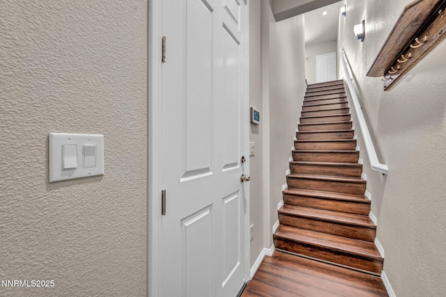 3074 Sterling Ridge Cir, Sparks, NV 89431 - stairway featuring a textured wall and wood finished floors