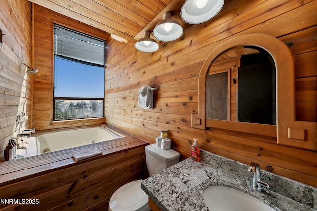 340 Quaking Aspen Ln # C, Stateline, NV 89449 - full bath with wood walls, a jetted tub, vanity, and toilet