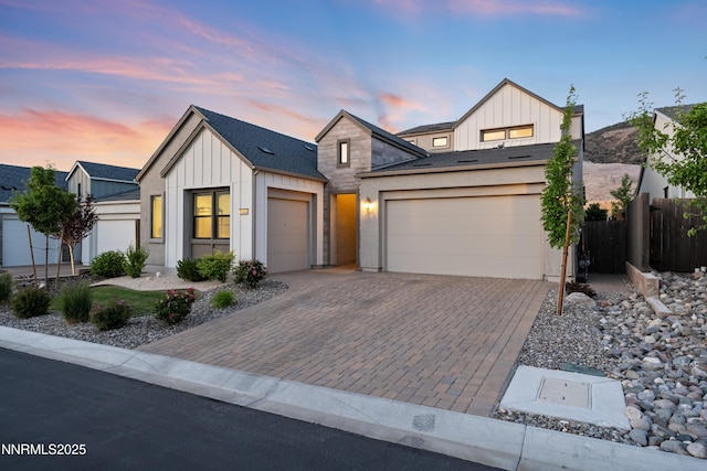 15058 Iron River Dr, Reno, NV 89521 - modern farmhouse style home featuring board and batten siding, an attached garage, and driveway