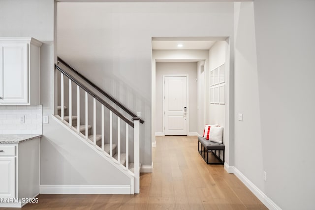 15058 Iron River Dr, Reno, NV 89521 - staircase with wood finished floors, baseboards, and recessed lighting