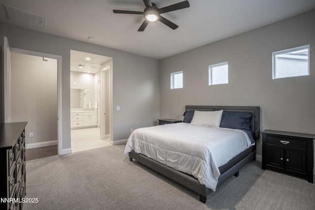 15058 Iron River Dr, Reno, NV 89521 - bedroom featuring light colored carpet, ensuite bathroom, baseboards, and a ceiling fan