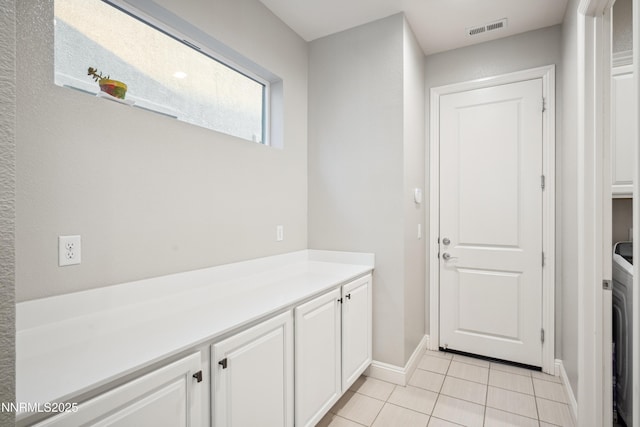 15058 Iron River Dr, Reno, NV 89521 - laundry area featuring cabinet space, baseboards, light tile patterned floors, and washer / dryer