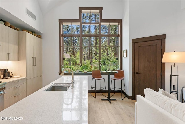 33 Beach Club Dr Unit 506, Stateline, NV 89449 - kitchen with light wood-style floors, a high ceiling, and modern cabinets