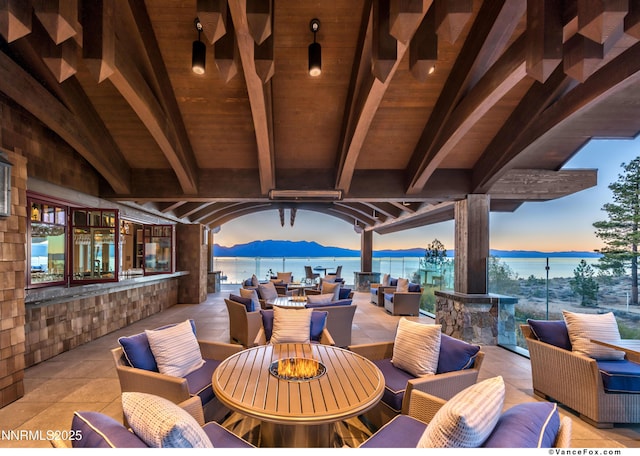 33 Beach Club Dr Unit 506, Stateline, NV 89449 - view of patio featuring an outdoor living space with a fire pit and a mountain view
