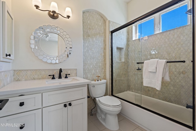 1020 N Cantlon Ln, Reno, NV 89521 - bathroom with tile patterned floors, toilet, vanity, and bath / shower combo with glass door