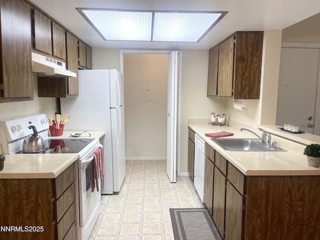 555 E Patriot Blvd, Reno, NV 89511 - kitchen with white appliances, under cabinet range hood, light floors, a sink, and light countertops