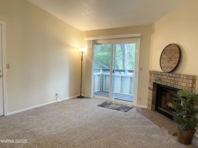555 E Patriot Blvd, Reno, NV 89511 - unfurnished living room with carpet flooring, a fireplace, baseboards, and lofted ceiling