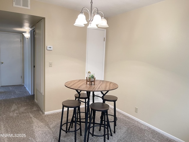 555 E Patriot Blvd, Reno, NV 89511 - carpeted dining area featuring baseboards and a chandelier