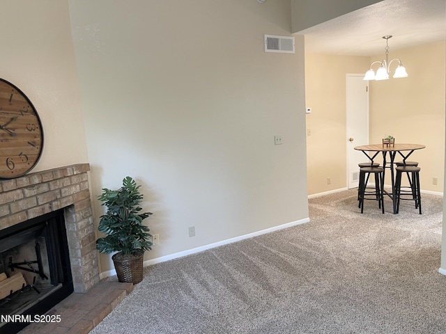 555 E Patriot Blvd, Reno, NV 89511 - carpeted dining area featuring a brick fireplace, baseboards, and a chandelier