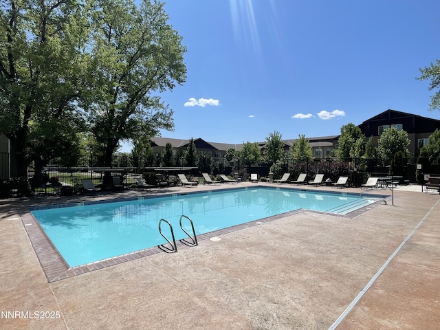 555 E Patriot Blvd, Reno, NV 89511 - community pool featuring a patio