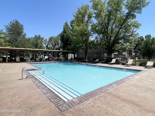 555 E Patriot Blvd, Reno, NV 89511 - community pool featuring a patio area