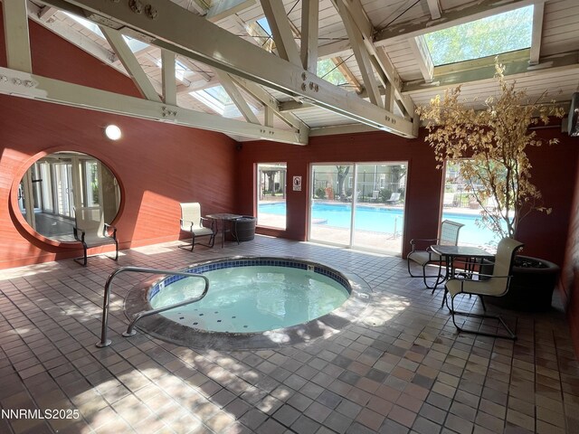 555 E Patriot Blvd, Reno, NV 89511 - view of swimming pool with a skylight and an in-ground hot tub