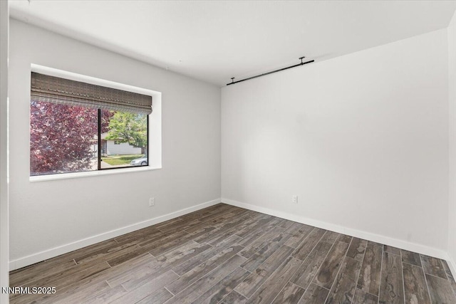 7620 Essex Way, Reno, NV 89506 - spare room featuring wood finished floors and baseboards