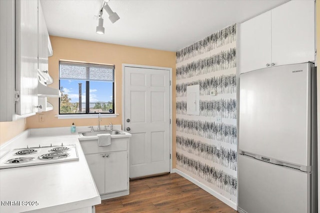 7620 Essex Way, Reno, NV 89506 - kitchen with white appliances, a sink, light countertops, white cabinets, and dark wood finished floors