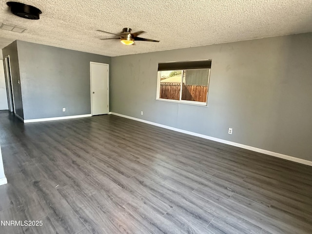 540 Anthony Ln, Fallon, NV 89406 - empty room with ceiling fan, dark wood finished floors, and a textured ceiling
